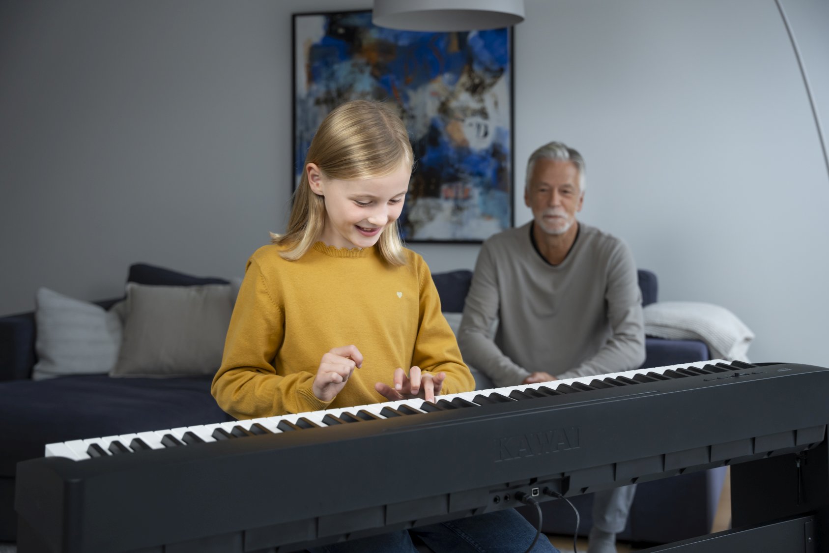 Girl playing Kawai ES60 digital piano