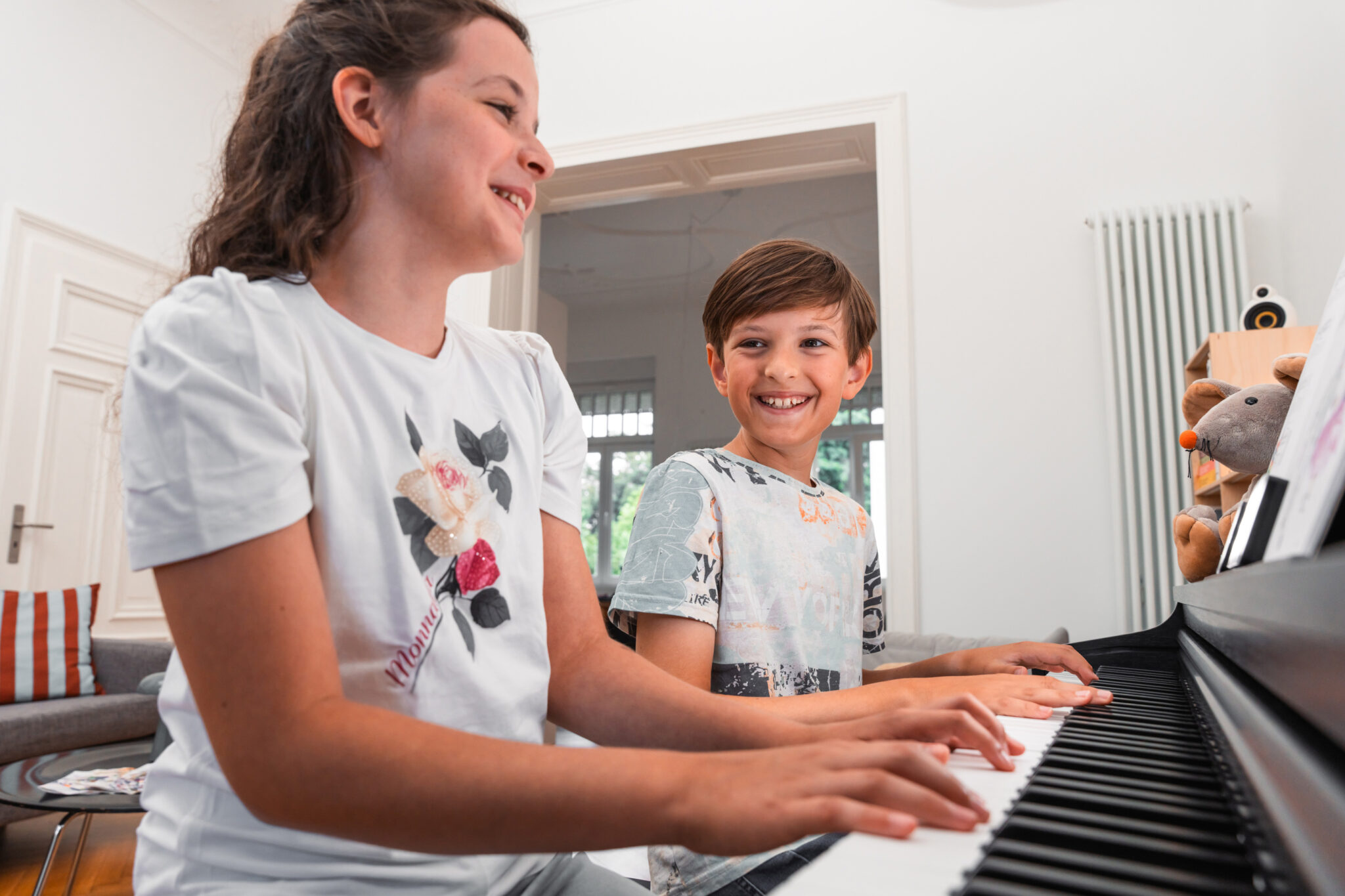 Kids playing the Kawai CX202 digital piano